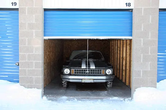 Black car parked in the garage